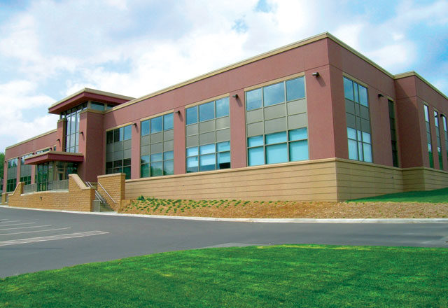 This image depicts a large law enforcement building with Mapes paneling.