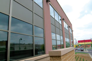 This image depicts a law enforcement building with Mapes paneling.