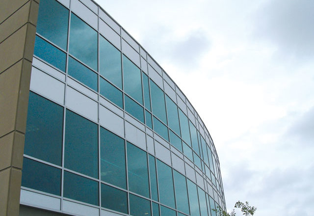 A commercial building using Mapes-R panels is pictured.