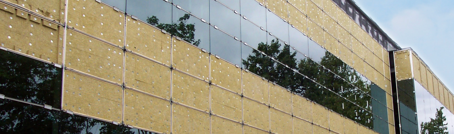 Mapes factory-manufactured insulated back pans seen on the side of a building.
